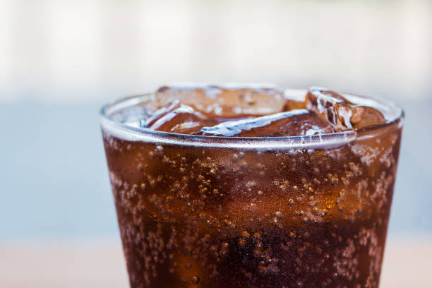 Close-up glass of diet soda with ice cubes.